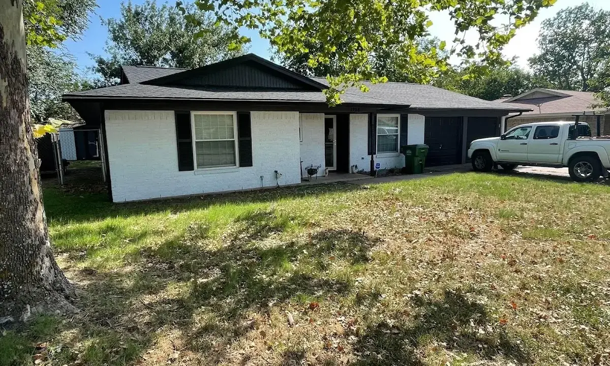 Professional roofing crew working on a residential roof in Cedartown
